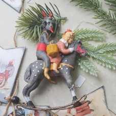 Devil Krampus with Misbehave Girl on rocking horse Unique Christmas Ornament